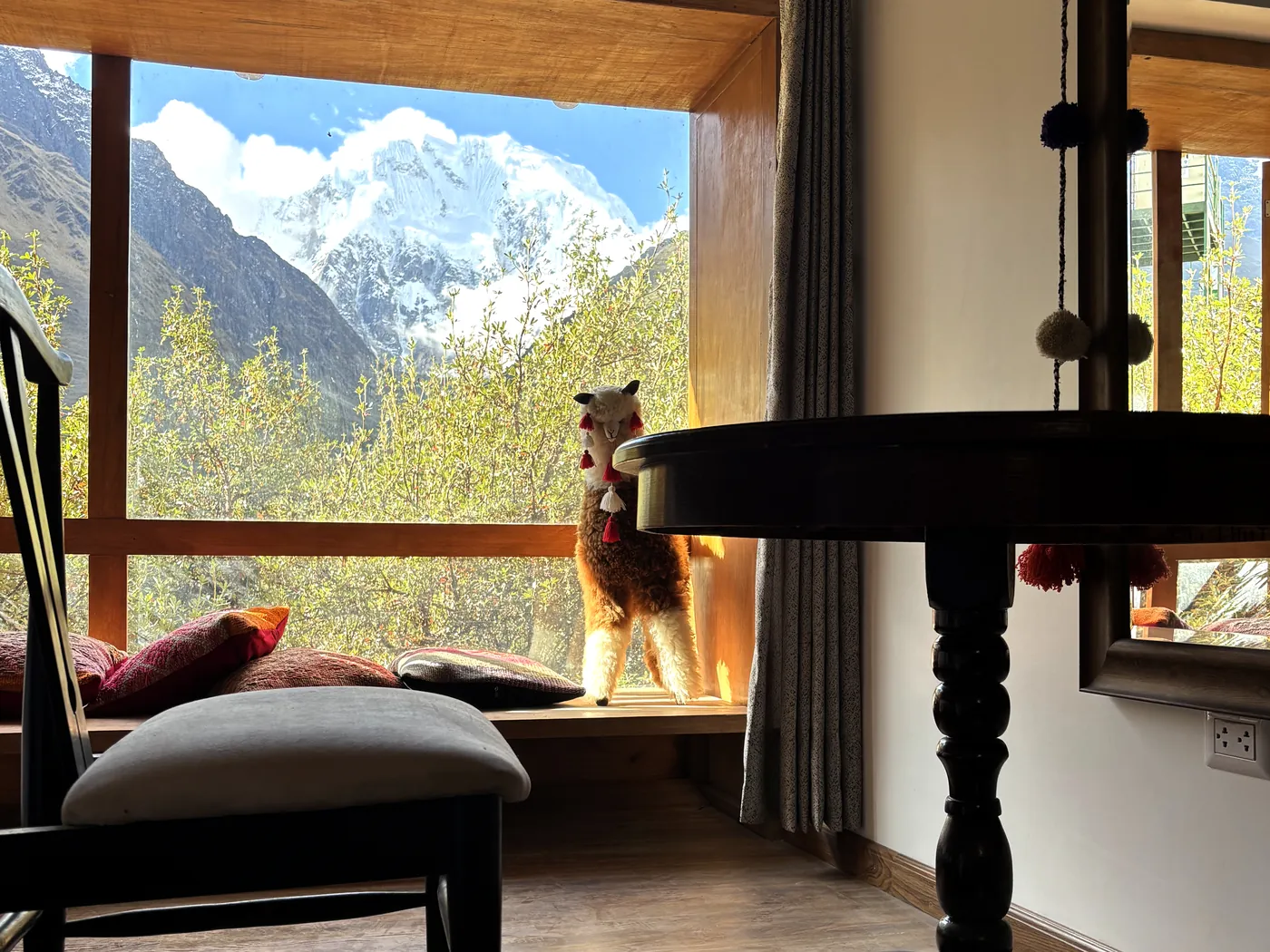 Salkantay Lodge nestled in the Andean highlands with mountain backdrop